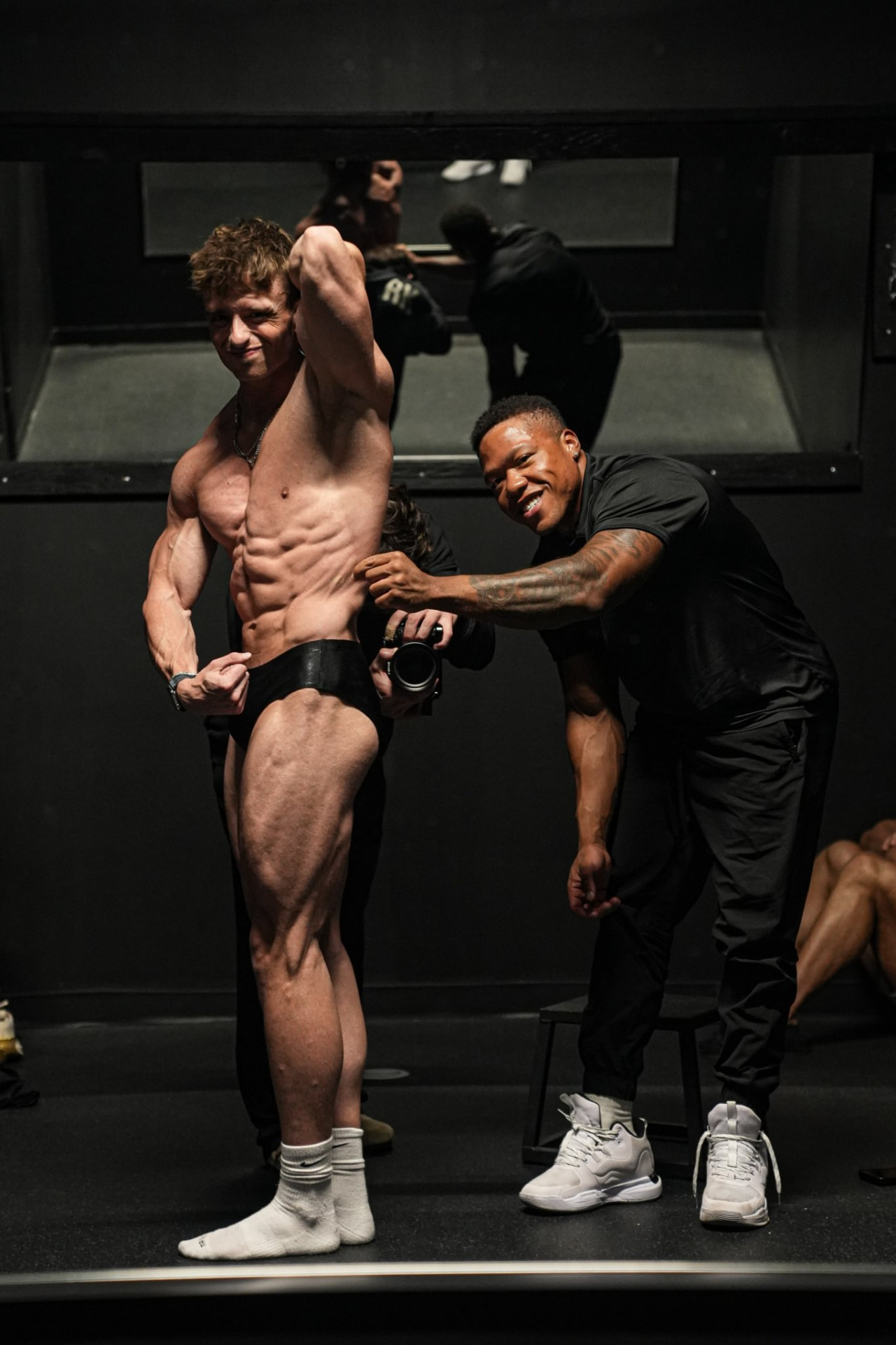 Coach Daylen prepping a client backstage before stage call-outs